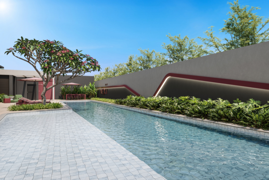 Área de lazer composta por uma piscina, e plantas e vegetações ao redor.