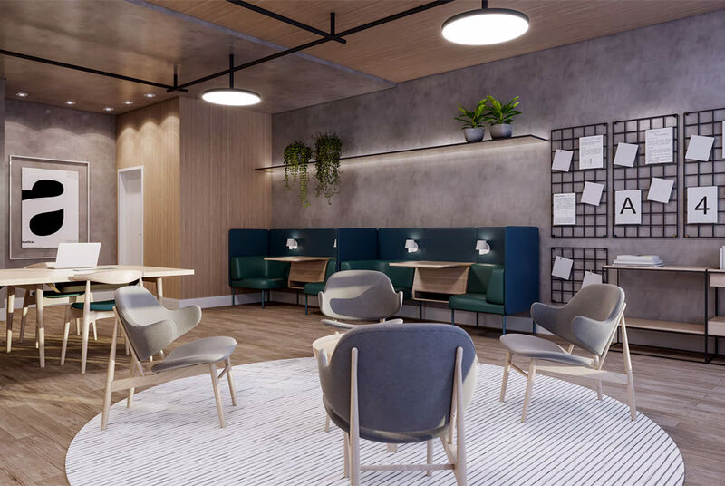 Sala moderna de coworking com áreas de descanso.