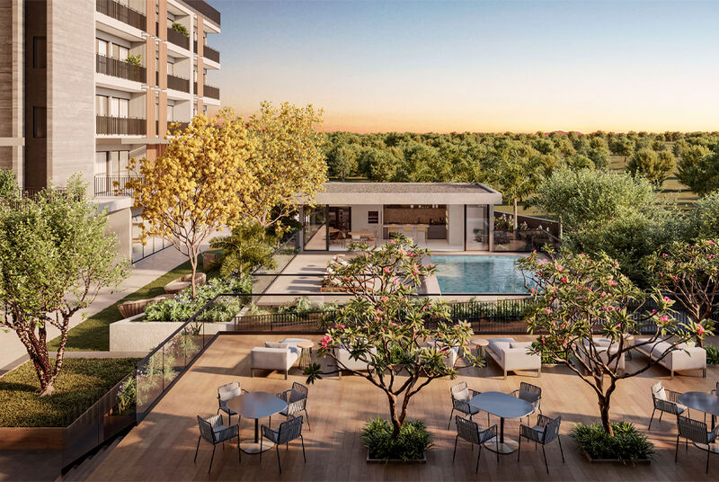 Área de lazer com piscina e paisagismo luxuoso