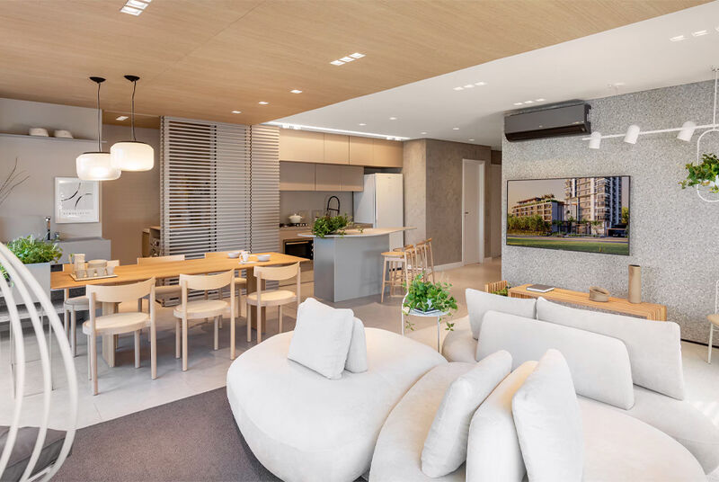 Sala de estar moderna com cozinha integrada e decoração elegante.