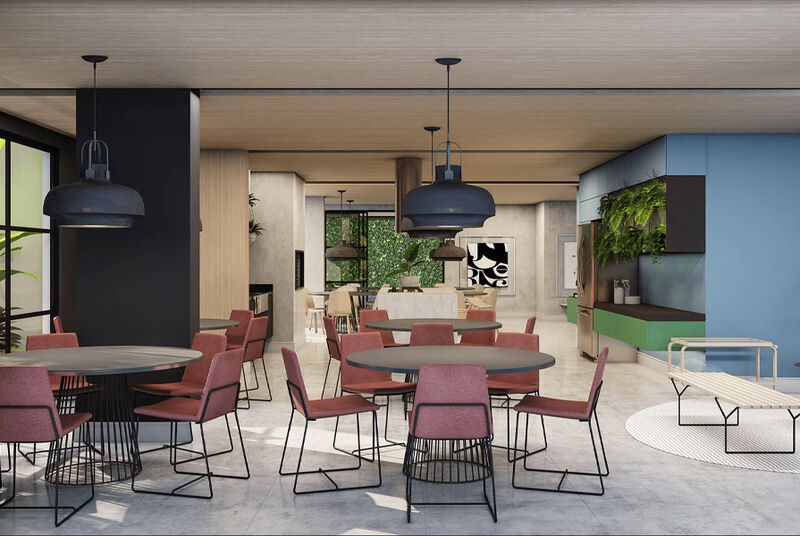 Área externa moderna de restaurante com vista para o pôr do sol.