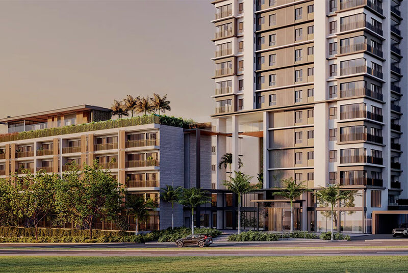 Fachada de moderno edifício residencial com áreas verdes.